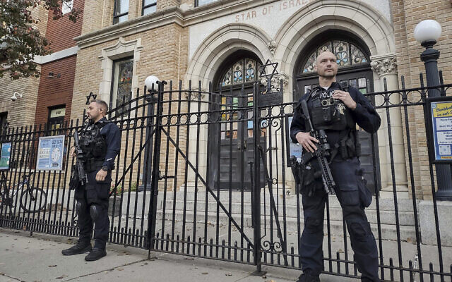 File: Hoboken Police officers stand watch outside the United Synagogue of Hoboken, New Jersey, November 3, 2022. (AP Photo/Ryan Kryska)