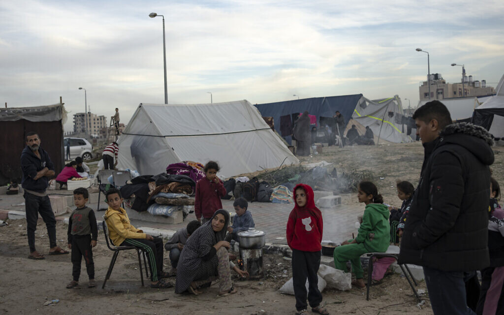 Palestinians displaced by the Israeli ground offensive on the Gaza Strip set up a tent camp in the al-Mawasi area Thursday, Dec. 7, 2023. AP Photo/Fatima Shbair)