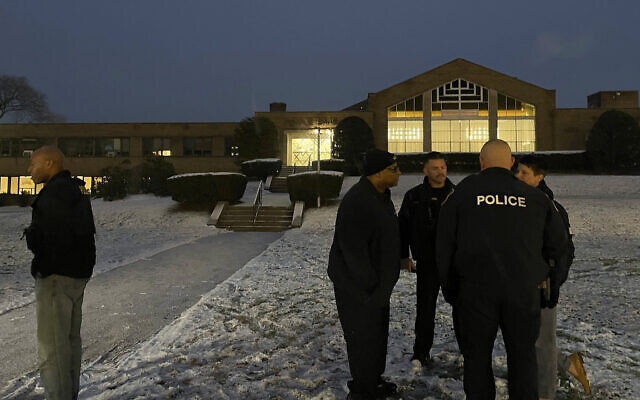 Albany police officers gather outside Temple Israel, December 7, 2023, in Albany, New York.(AP Photo/Maysoon Khan)