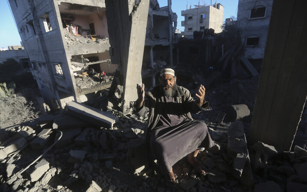 A Palestinian reacts after an Israeli strike on residential buildings in Rafah, Gaza Strip, on Friday, Dec. 15, 2023. (AP Photo/Hatem Ali)