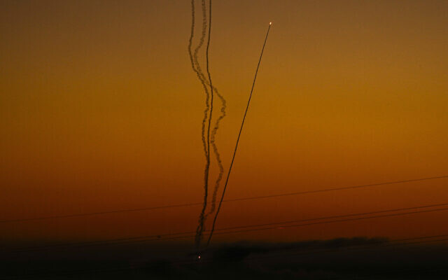 Rockets are fired toward Israel from the Gaza Strip, as seen from southern Israel, December 15, 2023. (AP Photo/Ariel Schalit)