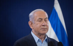 Prime Minister Benjamin Netanyahu attends a press conference at the Defense Ministry in Tel Aviv on November 22, 2023. (Chaim Goldberg/Flash90)
