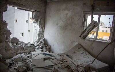 Damage to a home hit by a rocket in Ashkelon, December 5, 2023. (Edi Israel/Flash90)