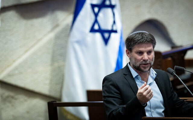 Finance Minister Bezalel Smotrich presents his 2023 wartime budget update to the Knesset, December 6, 2023 (Yonatan Sindel/Flash90)