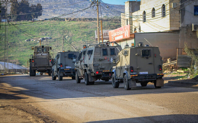 Military vehicles seen in the al-Far'a refugee camp, northeast of Nablus, in the West Bank, December 8, 2023. (Nasser Ishtayeh/Flash90)