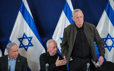 L-R Prime Minister Benjamin Netanyahu, Defense Minister Yoav Gallant, and Minister Benny Gantz attend a press conference at the Defense Ministry in Tel Aviv, December 16, 2023. (Noam Revkin Fenton/Flash90)