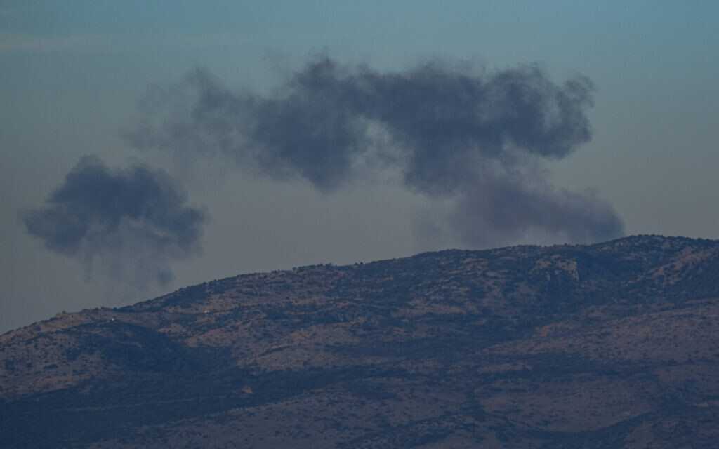 Smoke rises after rockets were fired from Lebanon into Israel, in the Mount Dov area, December 20, 2023. (Ayal Margolini/Flash90)
