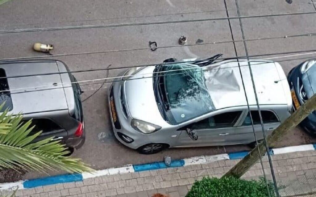 A car damaged by rocket shrapnel in Tel Aviv on December 8, 2023. (Courtesy)