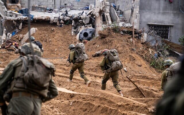 Israeli troops maneuver in the Gaza Strip on December 30, 2023. (IDF Spokesperson's Unit)