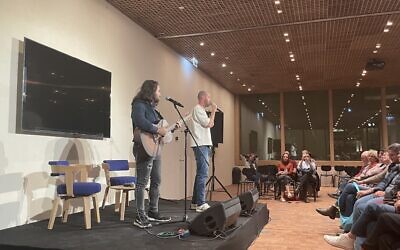 Rapper and singer Jimbo J (right), performing in the National Library of Israel's first in-person event in its new building, on November 29, 2023 (Jessica Steinberg/Times of Israel)