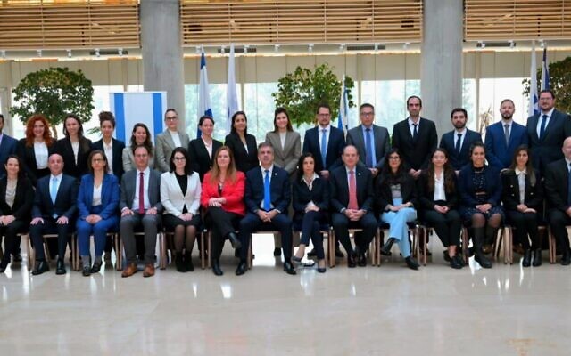 Candidates in the Foreign Ministry’s cadet course with Foreign Minister Eli Cohen (center) on December 24, 2023, in Jerusalem. (Foreign Ministry)