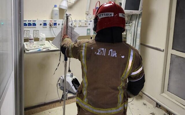 A firefighter at the scene of a blaze at Kaplan Medical Center, Rehovot, December 3, 2023. (Fire and Rescue services)