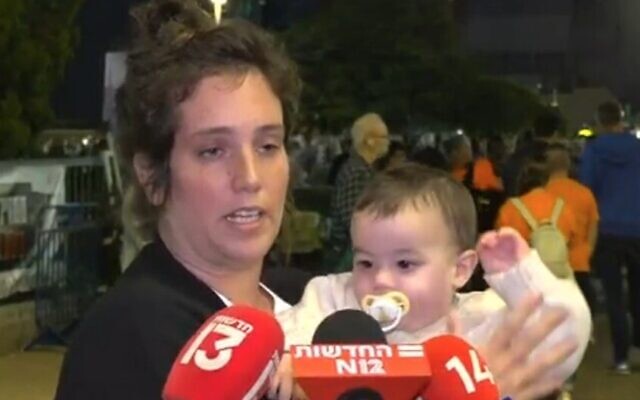 Yifat Zailer, cousin of Shiri Bibas, speaks to reporters on December 2, 2023 (Channel 12 screenshot; used in accordance with Cause 27a of the Copyright Law)