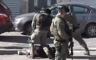 Israeli troops filmed brutally beating a Palestinian journalist in East Jerusalem on December 15, 2023. (Screen capture/X)