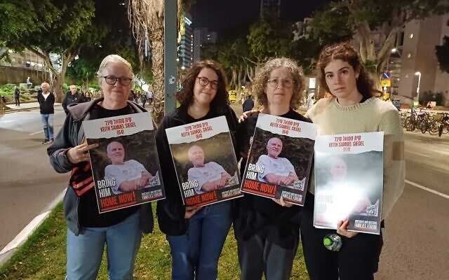 Fiona Wax, left, twin sister to Aviva Siegel (second from right), with Wax's daughter Tal (second from left) and Siegel's youngest daughter Shir (far right) on December 2, 2023 at a Tel Aviv rally to free the hostages (Courtesy)