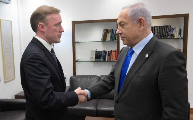 Prime Minister Benjamin Netanyahu greets US National Security Adviser Jake Sullivan in Tel Aviv, December 14, 2023. (Amos Ben Gershon/GPO)