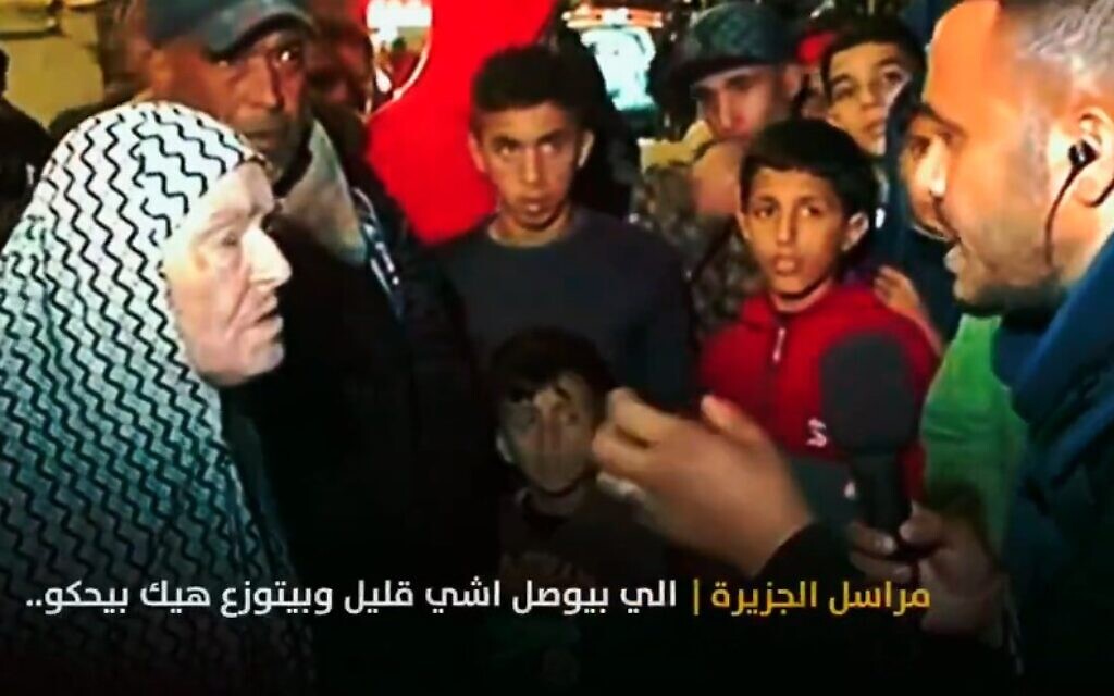 A Gaza resident (left) tells an Al Jazeera reporter (right) about Hamas taking humanitarian aid, in a clip aired on December 7, 2023 (X screenshot; used in accordance with Clause 27a of the copyright law)
