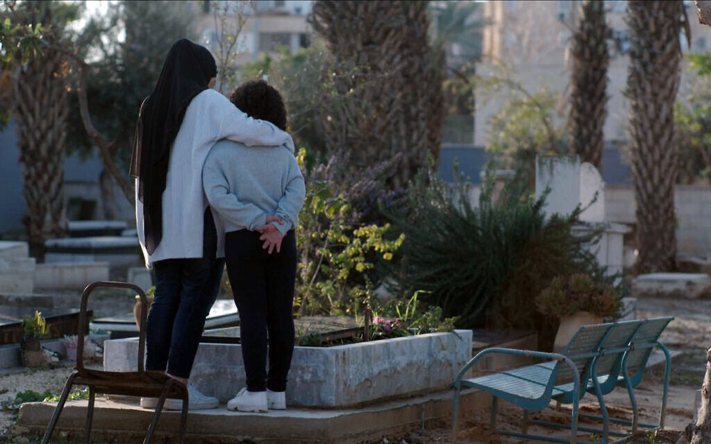 Marwa, left, and Milla, the widow and daughter of Musa Hassuna, an Arab Israeli man killed in a violent protest in Lod, in a still from 'Mourning in Lod,' directed by Hilla Medalia. (Courtesy of MTV Documentary Films)