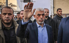 Yahya Sinwar (C), Hamas's Gaza Strip chief, waves to supporters in Gaza City, on April 14, 2023. (MOHAMMED ABED / AFP)