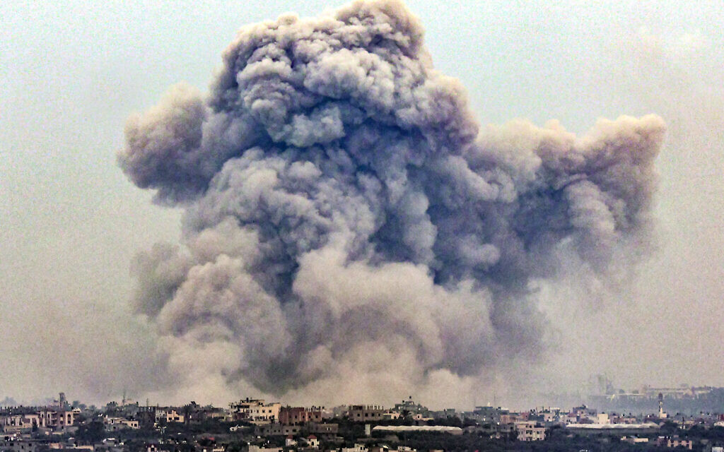 Smoke billows over Khan Yunis from Rafah in the southern Gaza strip during an Israeli airstrike on January 2, 2024 amid the ongoing war between Israel and  Hamas. (AFP)