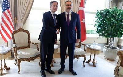 US Secretary of State Antony Blinken (L) shakes hands with Turkish Foreign Affairs Minister Hakan Fidan during a meeting at Vahdettin, a private residence of the presidency, in Istanbul, on January 6, 2024. (Evelyn Hockstein/Pool/AFP)