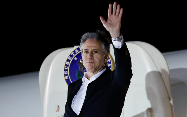 US Secretary of State Antony Blinken waves as he boards a plane leaving Crete for Amman, on January 6, 2024, as part of the first leg of a trip that includes visits to both Israel and West Bank. (Evelyn Hockstein/Pool/AFP)