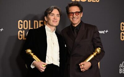 Irish actor Cillian Murphy and US actor Robert Downey Jr. pose in the press room with the awards for Best Performance by a Male Actor in a Motion Picture - Drama and Best Performance by a Male Actor in a Supporting Role in any Motion Picture during the 81st annual Golden Globe Awards at The Beverly Hilton hotel in Beverly Hills, California, on January 7, 2024. (Robyn BECK / AFP)