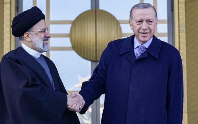 File: Turkish President Recep Tayyip Erdogan (R) shakes hands with Iranian President Ebrahim Raisi (L) during a welcoming ceremony in Ankara, on January 24, 2024. (Adem Altan/AFP)