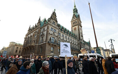 Protesters take part in a demonstration against racism and far-right politics on January 28, 2024 in front of the city hall in Hamburg, northern Germany. (MORRIS MAC MATZEN / AFP)