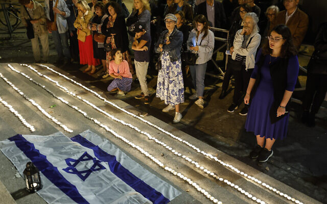 Members of the Jewish community light candles outside the synagogue in Strasbourg, France, October 11, 2023, four days after Hamas terrorists launched an unprecedented, multi-front massacre on Israel which killed over 1,200 people. (AP Photo/Jean-Francois Badias)