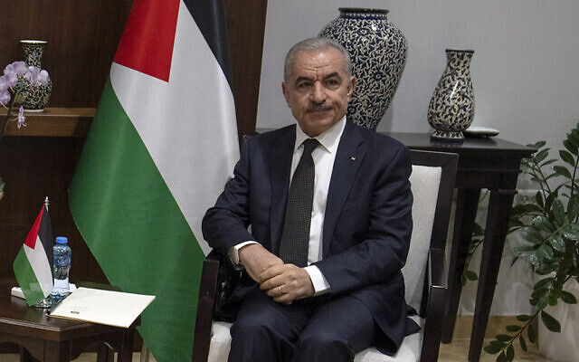 Palestinian Authority Prime Minister Mohammad Shtayyeh at his office in the West Bank city of Ramallah, November 17, 2023. (AP/Nasser Nasser, Pool)
