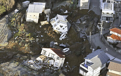 Houses fallen by an earthquake are seen in Kanazawa, Ishikawa prefecture, Japan, January 2, 2024. (Kyodo News via AP)