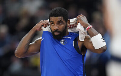 Dallas Mavericks guard Kyrie Irving comes off the bench during the first half of an NBA basketball game against the Utah Jazz, in Salt Lake City, January 1, 2024. (Rick Bowmer/AP)