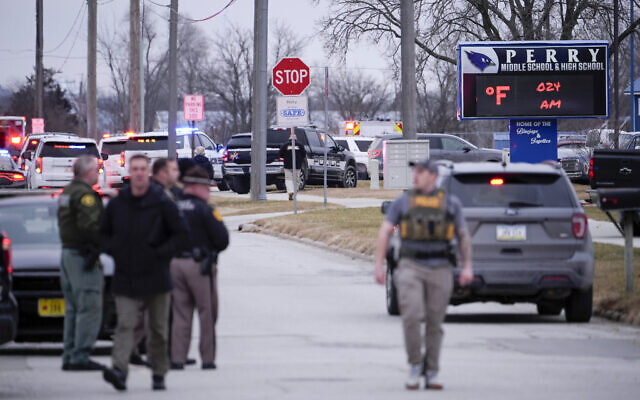 Police respond to Perry High School in Perry, Iowa., Thursday, Jan. 4, 2024. (AP Photo/Andrew Harnik)