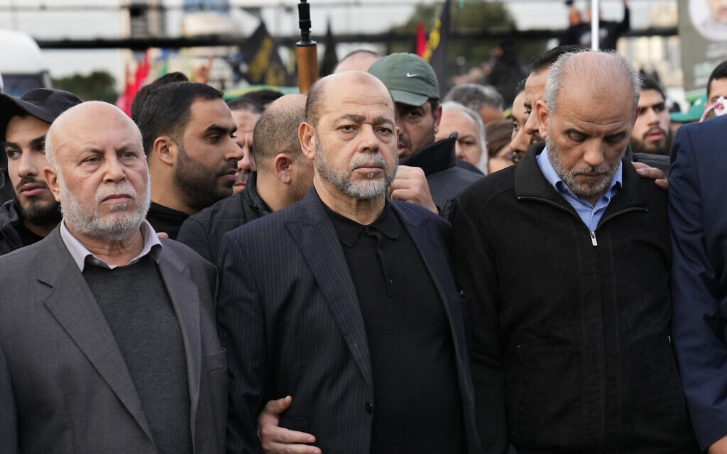 Senior Hamas official Moussa Abu Marzouk, center, attends the funeral of founding commander of the terror group's military wing Saleh al-Arouri, in Beirut, Lebanon, January 4, 2024. (AP/Hussein Malla)