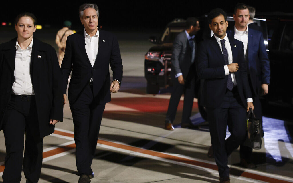 US Secretary of State Antony Blinken walks on the tarmac before departing for Tel Aviv, during his week-long trip aimed at calming tensions across the Middle East, at the airport in Al Ula, Saudi Arabia, January 8, 2024. (Evelyn Hockstein/Pool Photo via AP)