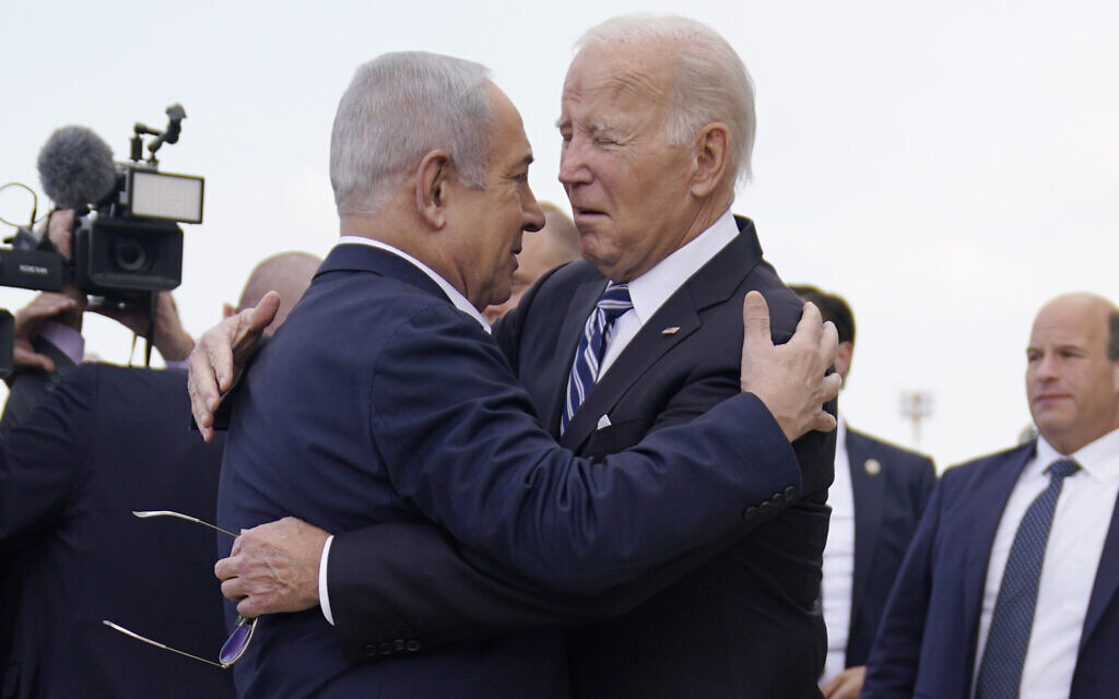President Joe Biden is greeted by Israeli Prime Minister Benjamin Netanyahu after arriving at Ben Gurion International Airport, on Oct. 18, 2023, in Tel Aviv. (AP Photo/Evan Vucci)