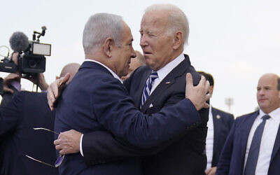 President Joe Biden is greeted by Israeli Prime Minister Benjamin Netanyahu after arriving at Ben Gurion International Airport, on Oct. 18, 2023, in Tel Aviv. (AP Photo/Evan Vucci)