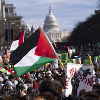With the US Capitol in the background, demonstrators rally during the March on Washington for Gaza at Freedom Plaza in Washington, Saturday, Jan. 13, 2024. (AP Photo/Jose Luis Magana)