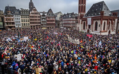 People gather as they protest against the AfD party and right-wing extremism in Frankfurt/Main, Germany, January 20, 2024. (Michael Probst/AP)