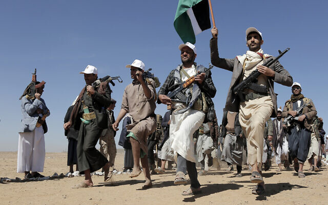 Houthi fighters march during a rally of support for the Palestinians in the Gaza Strip and against the US strikes on Yemen outside Sana'a on Monday, January 22, 2024. (AP Photo)