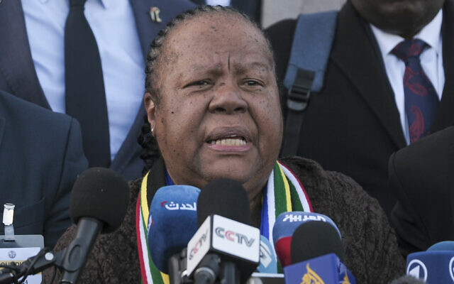 South Africa's Foreign Minister Naledi Pandor, center, addresses reporters after a session of the International Court of Justice, or World Court, in The Hague, Netherlands, Friday, January 26, 2024. (AP Photo/Patrick Post)