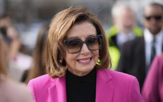 Speaker Emerita Nancy Pelosi walks to a news conference to address sea level rise along the city's waterfront in San Francisco, Friday, January 26, 2024. (AP Photo/Eric Risberg)