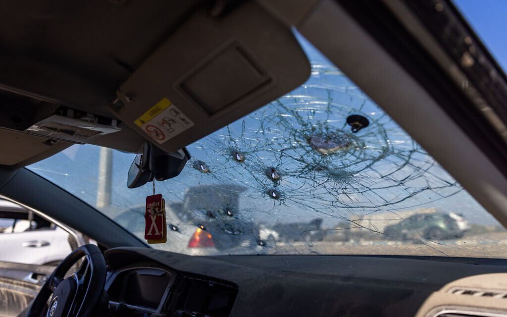 A car riddled with bullet holes during the October 7 massacre seen at the Erez border crossing with the Gaza Strip, January 4, 2024. (Chaim Goldberg/Flash90)