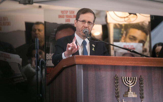 President Isaac Herzog speaks during a 24-hour rally for hostages marking 100 days since the start of the war between Israel and Hamas, at Hostages Square in Tel Aviv, on January 14, 2024. (Miriam Alster/ Flash90)