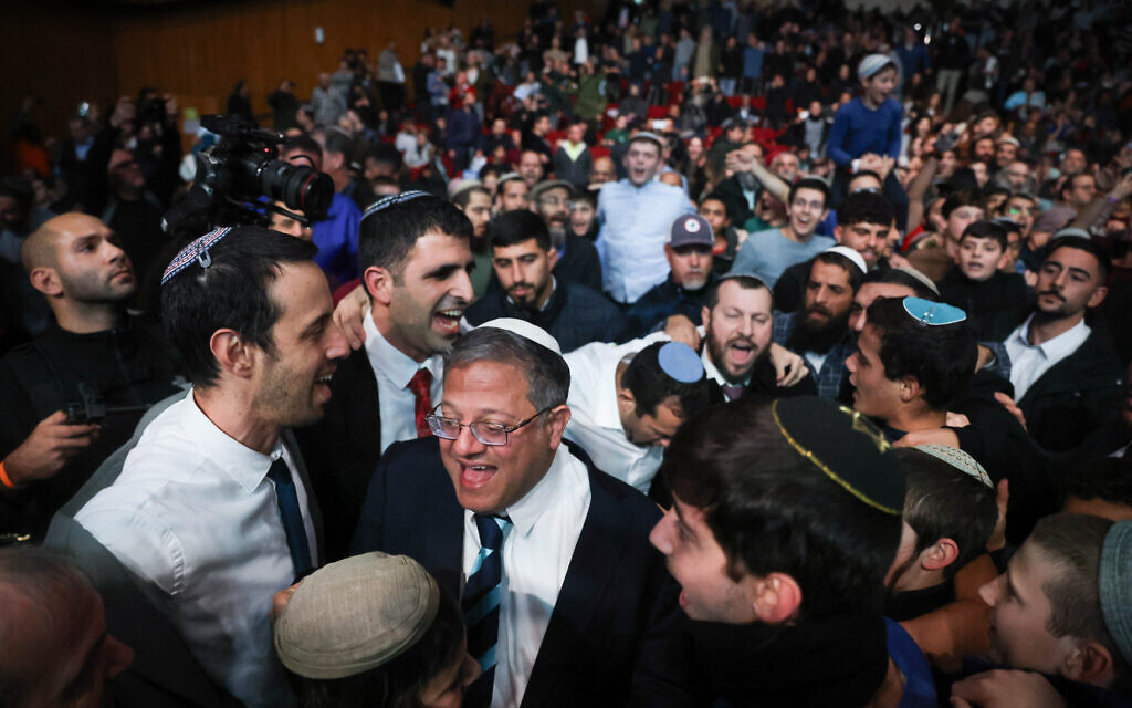 Ministers and MKs dance during a conference calling to resettle the Gaza Strip at the International Convention Center in Jerusalem on January 28, 2024. (Chaim Goldberg/Flash90)