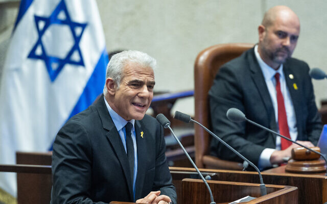 Opposition Leader MK Yair Lapid speaks in support of a no-confidence motion against Prime Minister Benjamin Netanyahu, in a plenum session of the Knesset, January 29, 2024. (Yonatan Sindel/Flash90)