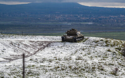 An old tank in the snow in the Golan Heights, northern Israel, January 31, 2024. (Ayal Margolin/Flash90)