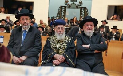 Chief Ashkenazi Rabbi David Lau, left, attends a Chief Rabbinate Council meeting with his Sephardic counterpart Rabbi Yitzhak Yosef and David Lau's father and predecessor Meir Lau, in Jerusalem on December 24, 2023. (Courtesy of the Chief Rabbinate)
