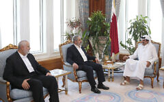 Emir Tamim bin Hamad al-Thani (L), ruler of Qatar since 2013, in a meeting with Hamas leaders Ismail Haniyeh (R) and Khaled Mashal in Doha, October 17, 2016 (Qatar government handout)